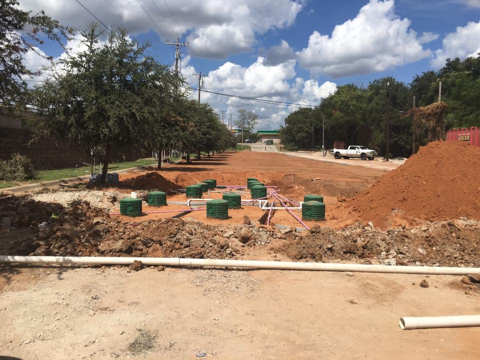 Aerobic septic tanks and pipe layout during installation on a Hood County property
