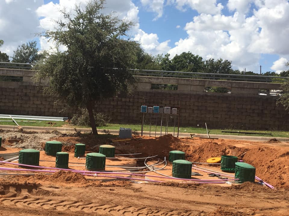 Aerobic septic system tanks and control panel wiring being installed on a Granbury-area property
